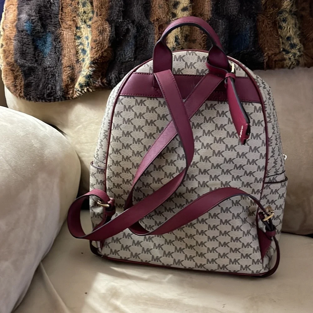 Michael Kors backpack a regular sized. Tan & burgundy with all the zippers. - Picture 2 of 8